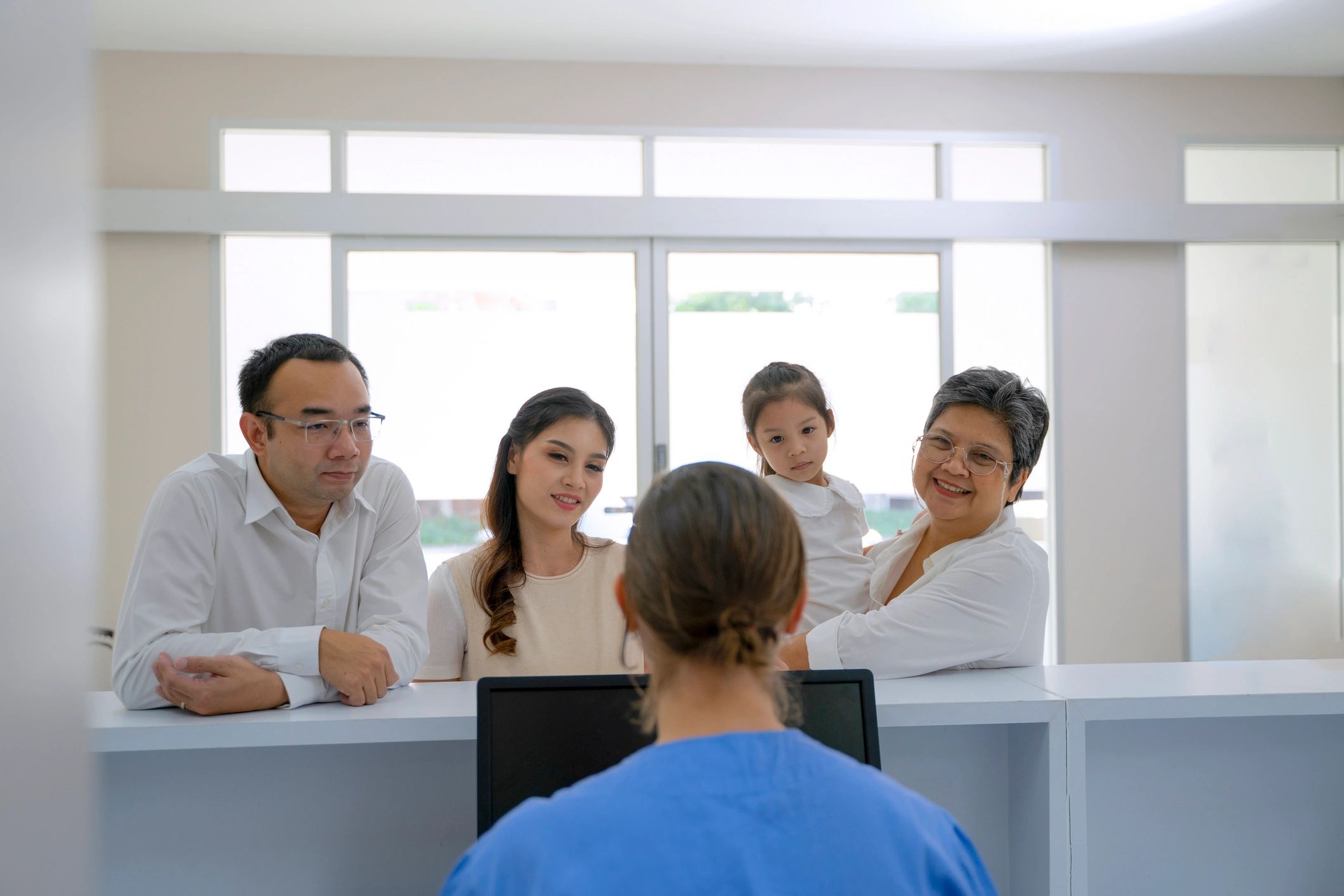 Asian family visiting a clinic together