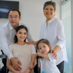 Asian family at a clinic entrance