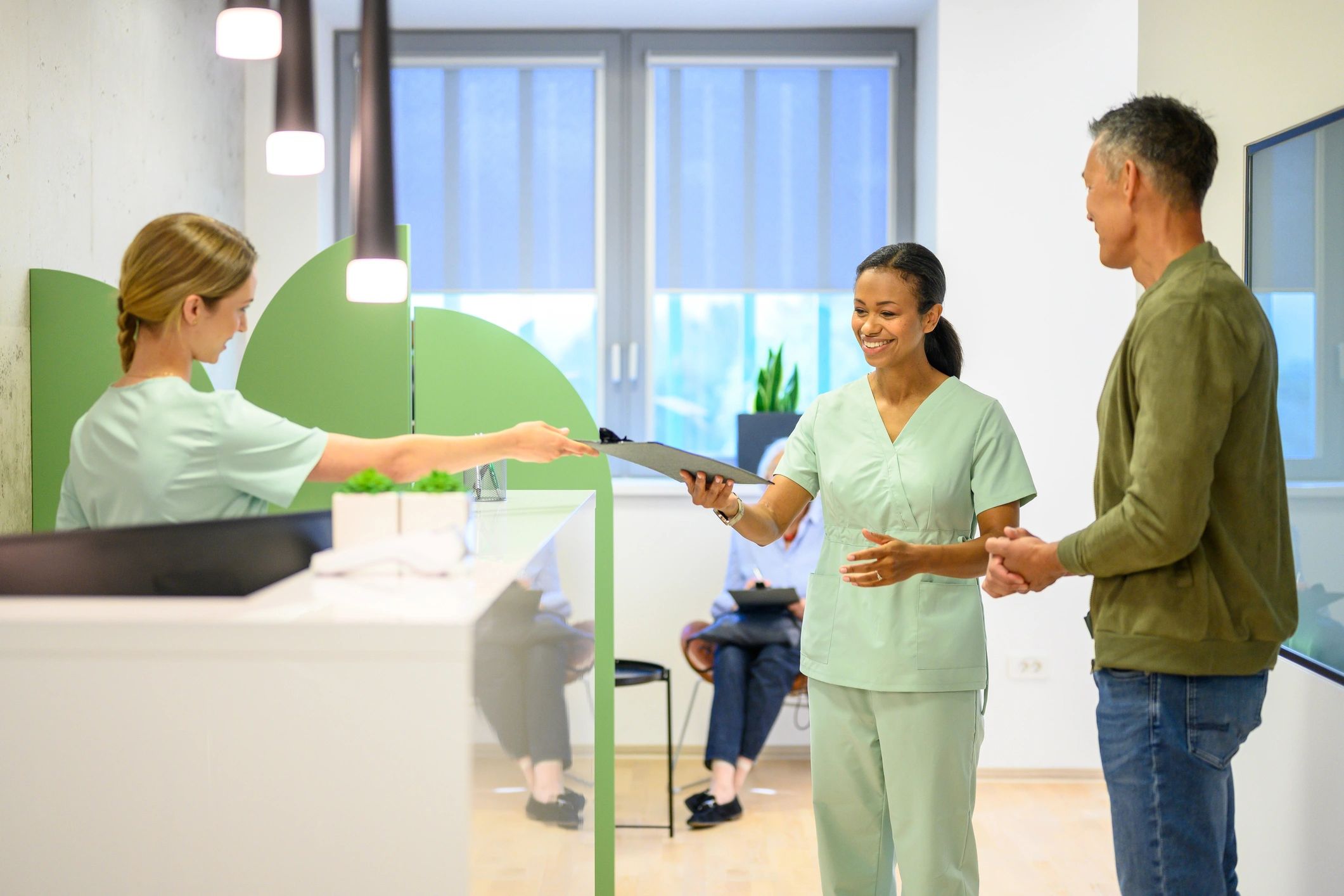 Clinic staff assisting a patient