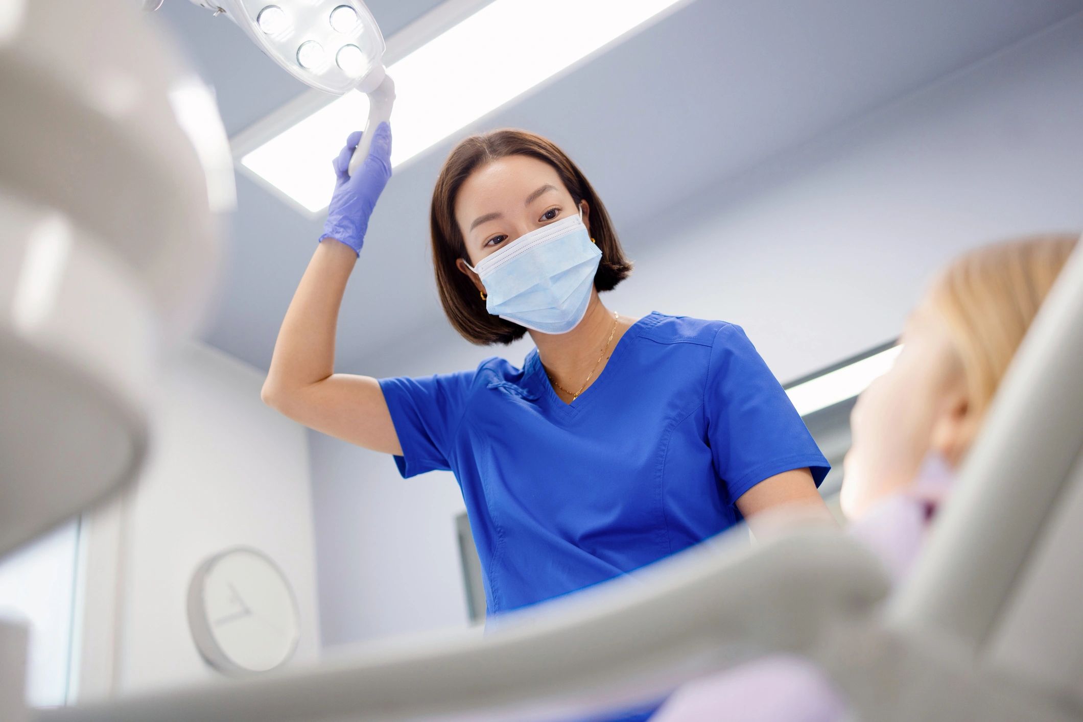 Asian child patient with dental professional in clinic